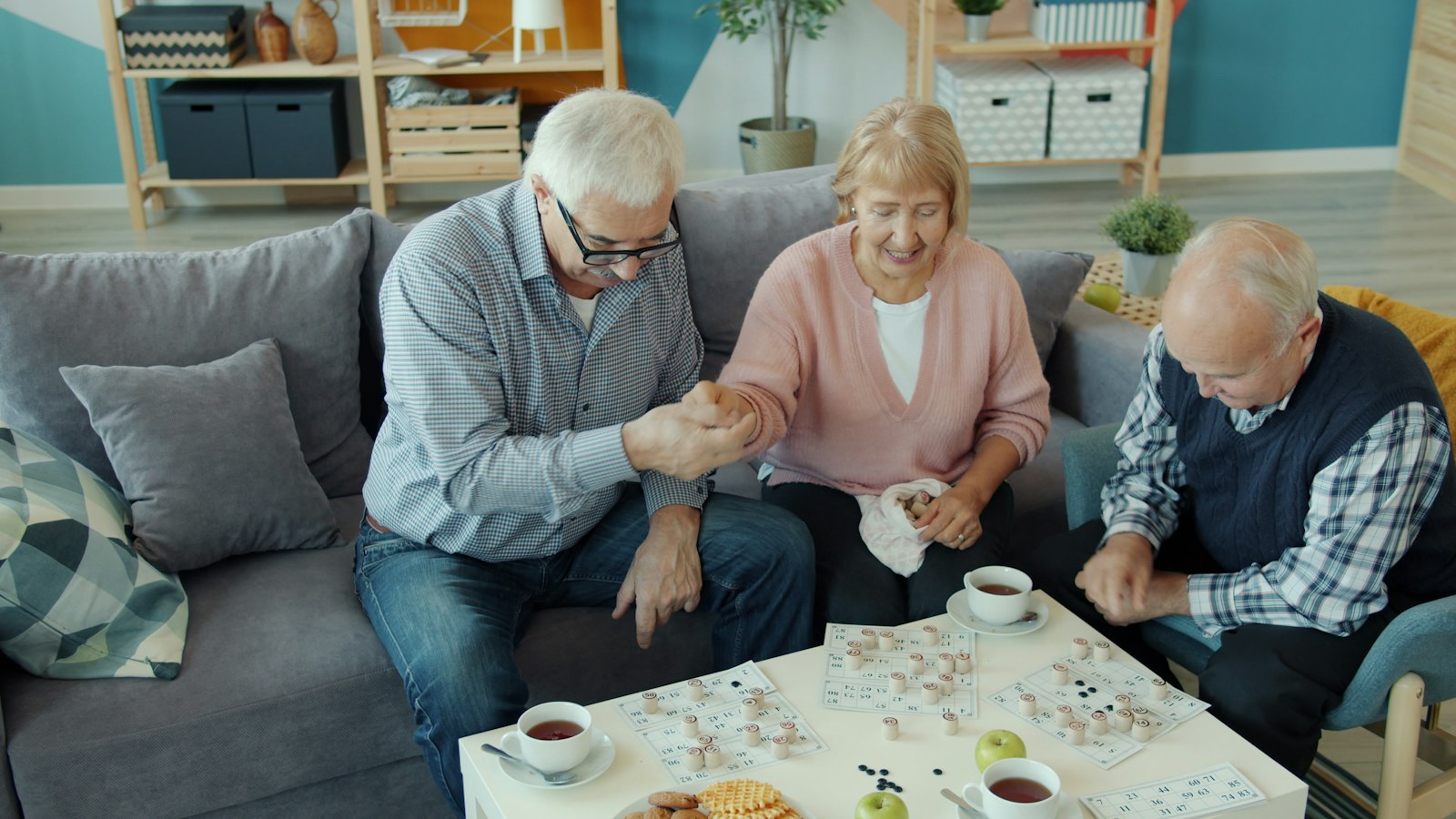 Seniors enjoying a game with a caregiver during companion care in Edmonton